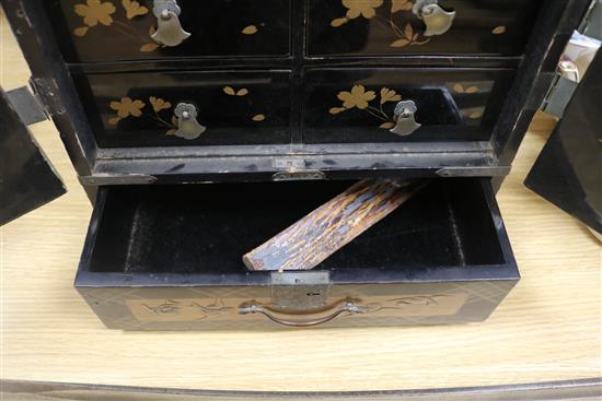 A Japanese lacquer cabinet on stand